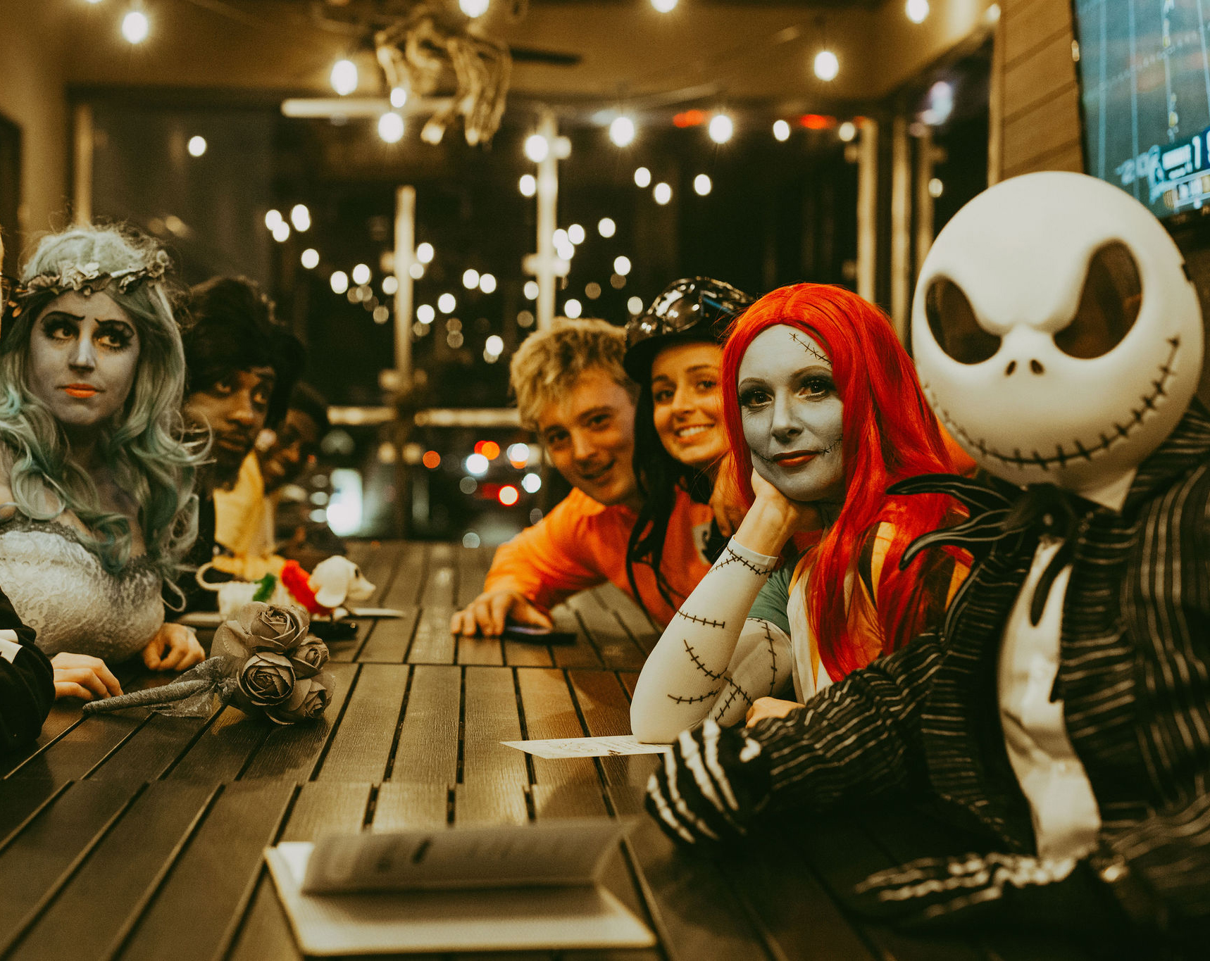 The Republic on Grand table filled with guests dressed in Halloween costumes